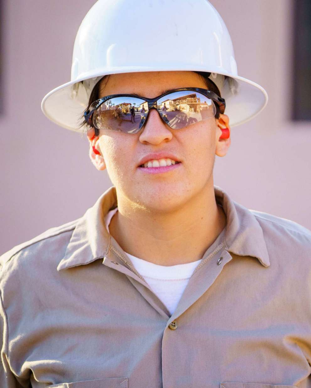 Careers Page Sign, Billboard, and Display Background Image A Sign, Billboard, and Display worker installs a sign in a hallway