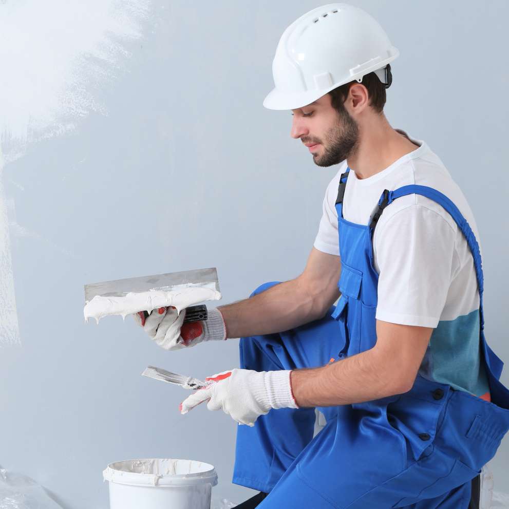Careers Page Sign, Billboard, and Display Background Image A Sign, Billboard, and Display worker installs a sign in a hallway