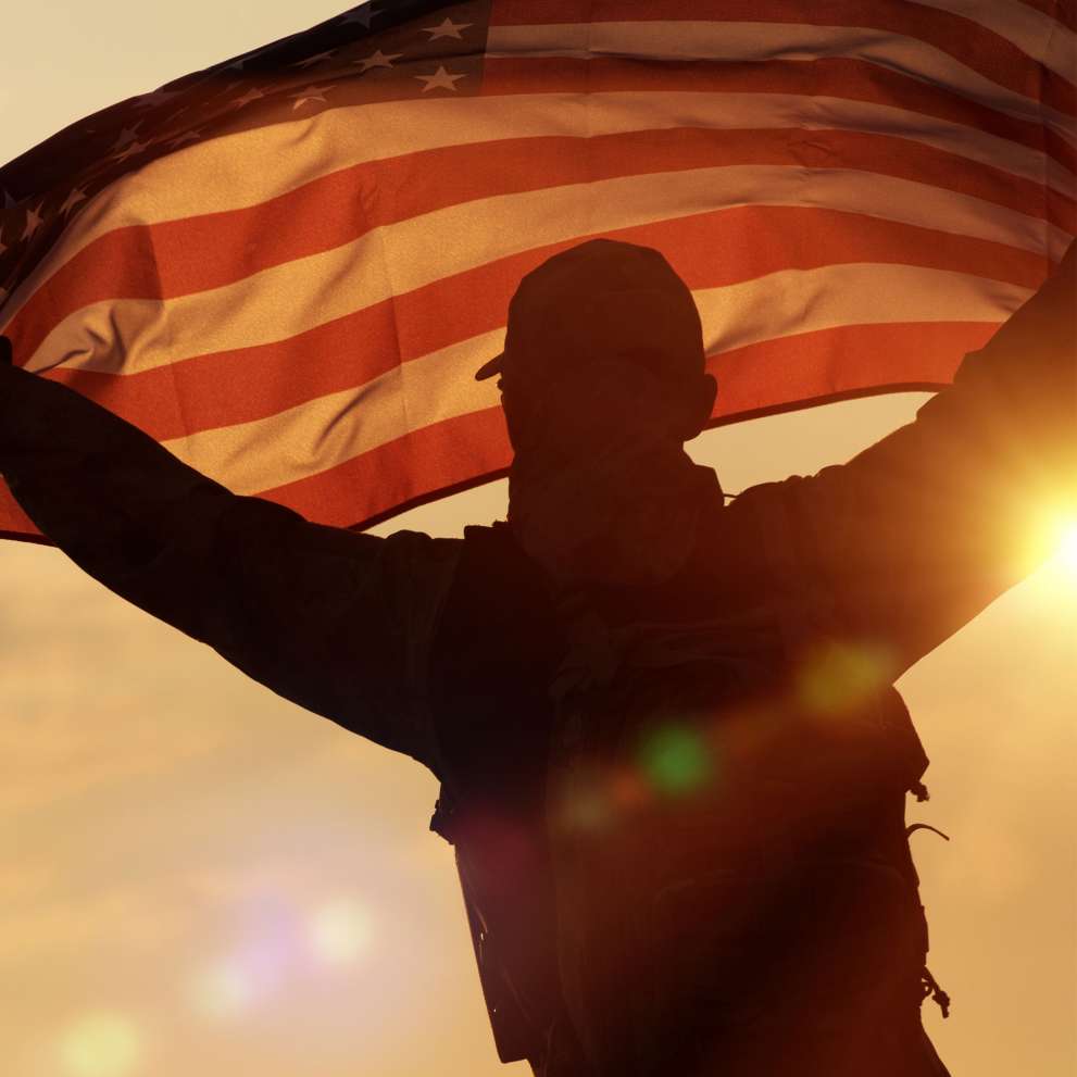 Student Story hero image soldier holding American flag