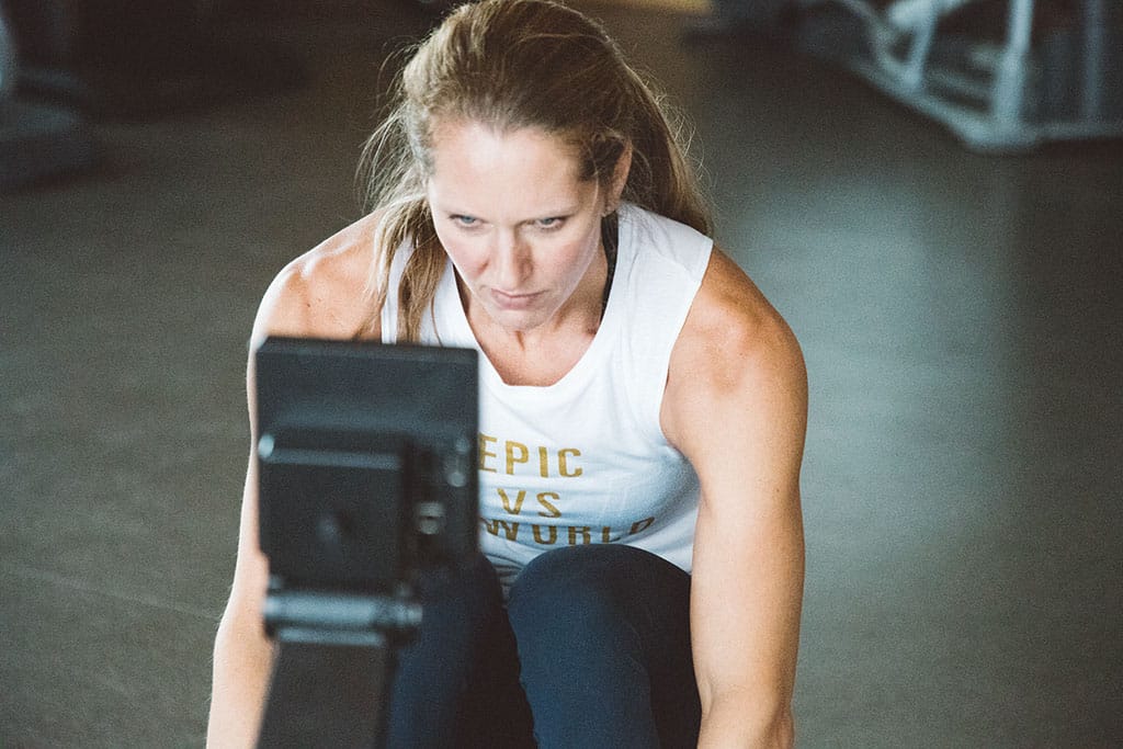 Female rowing wearing an Epic vs The World Tank