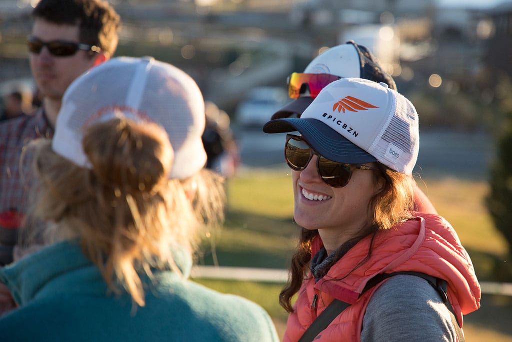 Female wearing an Epic BZN trucker cap
