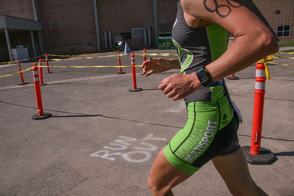 Milica running the Montana State triathlon in a Montana Multisport kit