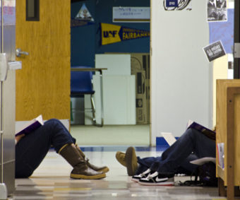 Students study in the hallway at Yaakoosge Daakahidi Alternative High School. (Photo by Heather Bryant)