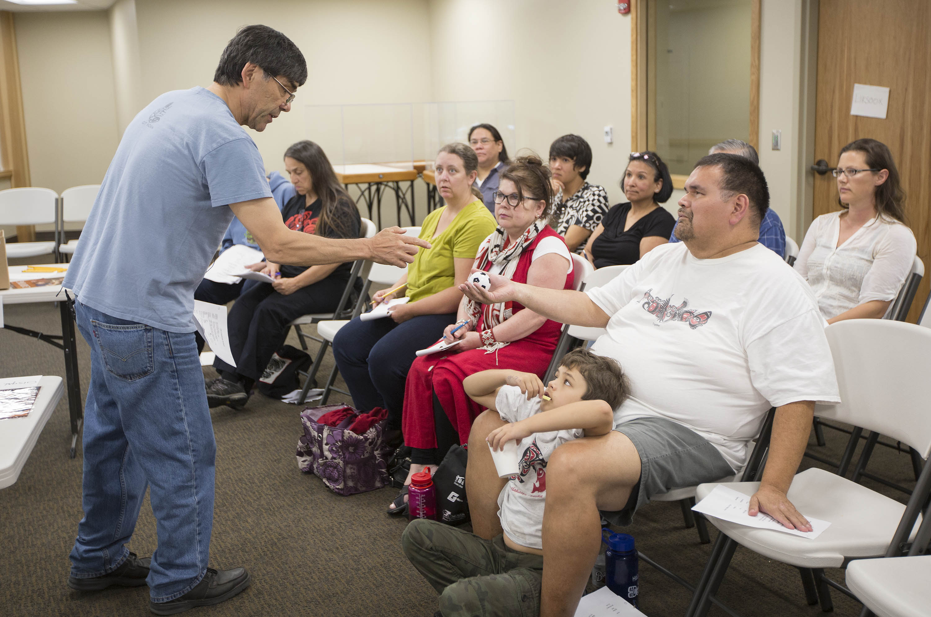 Boxley demonstrates with the Tsimshian language class. UAS student David Russell-Jensen sits second from the left in the back row. (Photo courtesy Brian Wallace/Sealaska Heritage Institute)