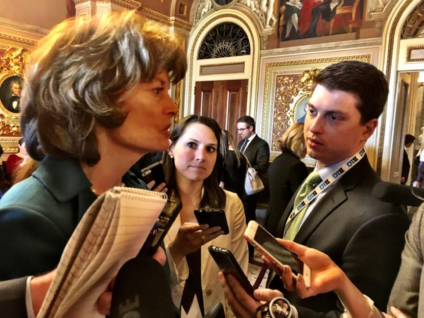 U.S. Sen. Lisa Murkowski, R-Alaska, speaks to reporters in one of the Senate’s more ornate rooms. (Photo by Liz Ruskin/Alaska Public Media)