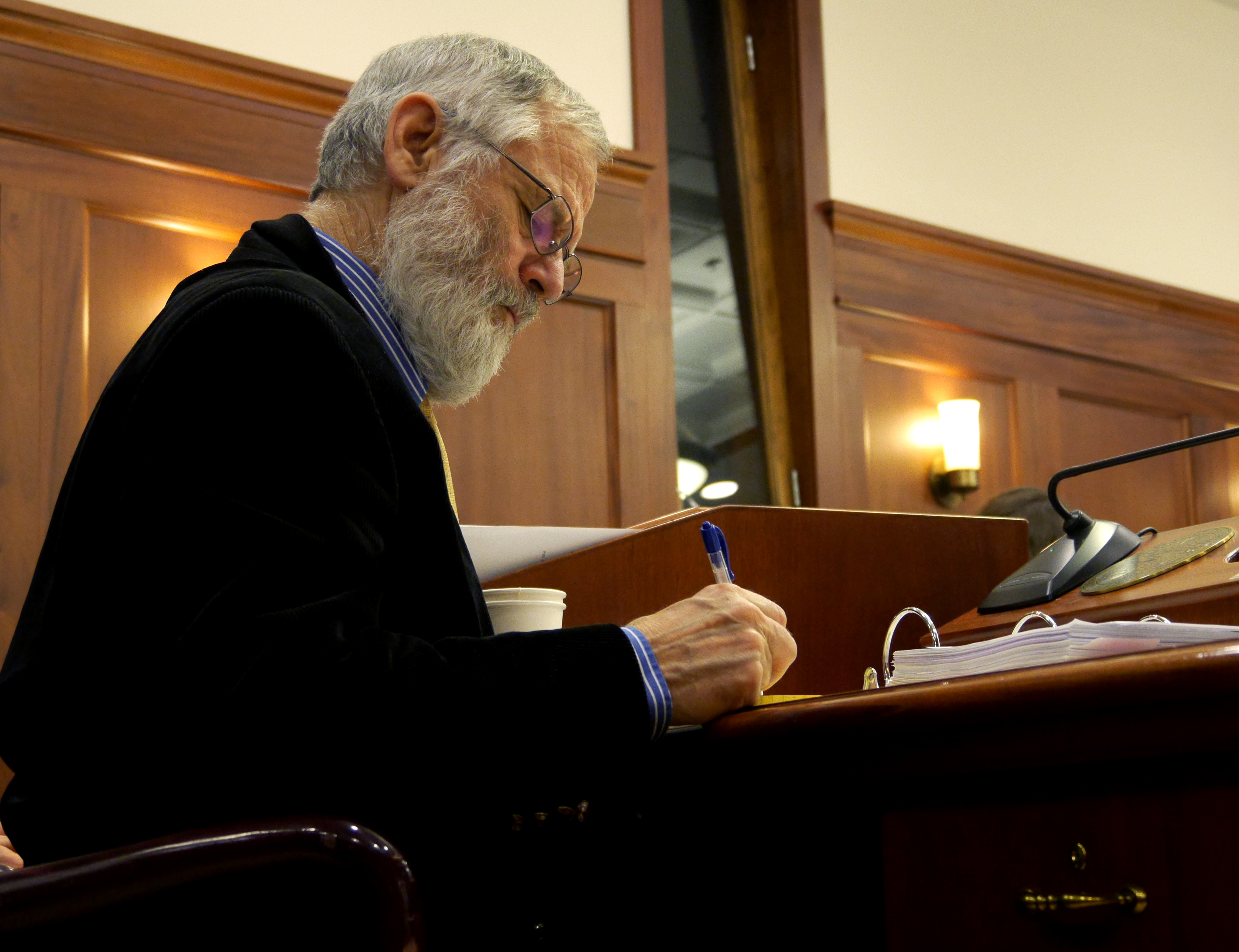 Rep. Paul Seaton. R-Homer, works at his desk in the House Chambers during the hours-long deliberations on HB 111, an oil tax bill, April 10 , 2017. (Photo by Skip Gray/360 North)