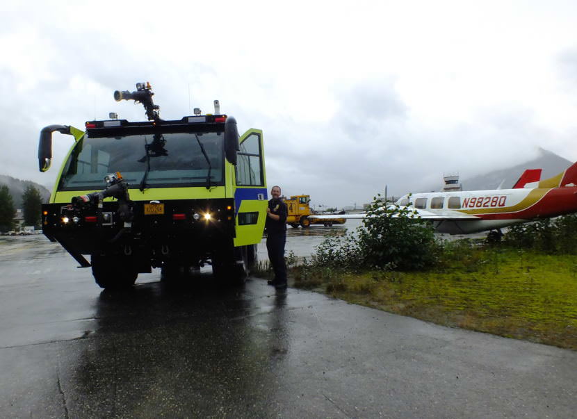 Firefighter Craig Brown with A-1, Capital City Fire/Rescue's newest Airport Rescue Firefighting (ARFF) vehicle, at Juneau International Airport in August 2018. This vehicle will likely be used during a disaster exercise planned at the airport on July 20, 2019.