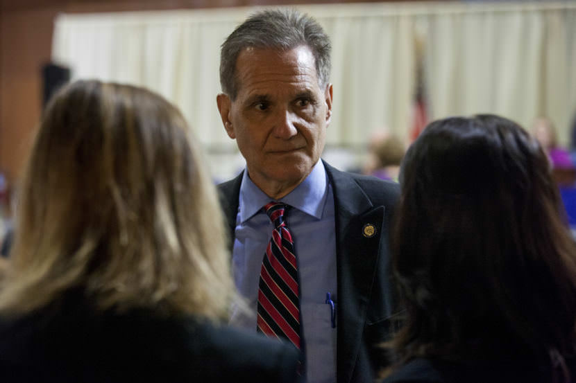 Sen. Kevin Meyer, R-Anchorage, talks with an aide and Sen. Mia Costello, R-Anchorage, before a Senate floor session in May 2016 in Juneau. Meyer blames Gov. Bill Walker for early candidate filings, after Walker called a special session. (Photo by Rashah McChesney/KTOO)