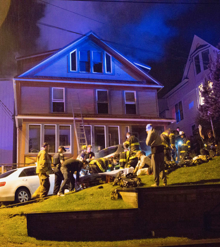 EMTs work on patients during a house fire at 526 Seward Street on Sept. 17, 2017. (Photo courtesy of Brian Wallace)