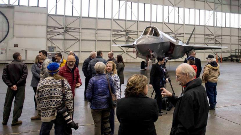 Event attendees mill around an F-35 in an Eielson Air Force Base hangar on Tuesday, Oct. 17, 2017.