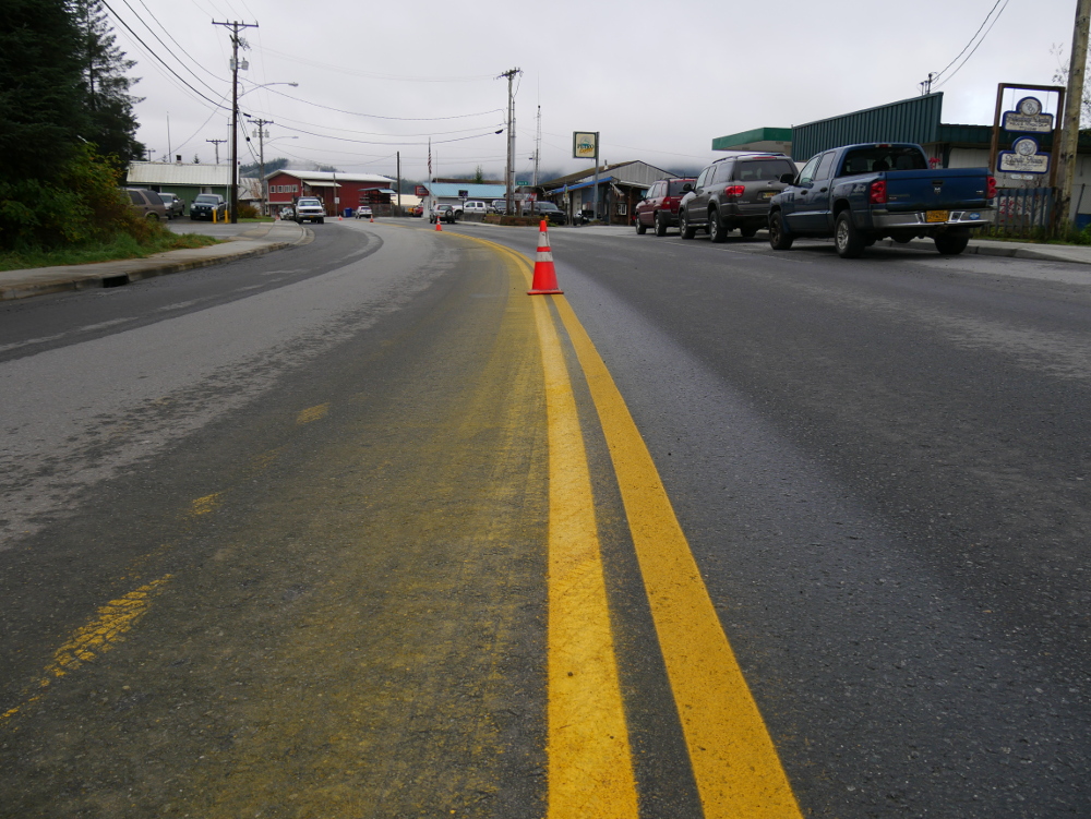 Cones cover slow-drying yellow lines on South Nordic Drive in Petersburg on Thursday, October 12, 2017. (Photo by Joe Viechnicki/KFSK)