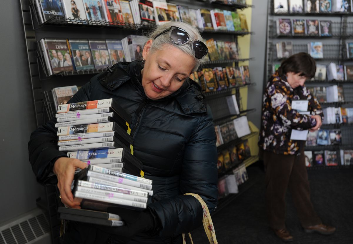 Masha Hughton purchased the BBC series "Monarch of the Glen," which is based in Scotland, from the Blockbuster store at corner of Old Seward Highway and Huffman Road after it began selling its inventory on Tuesday. (Photo by Bill Roth/Anchorage Daily News)