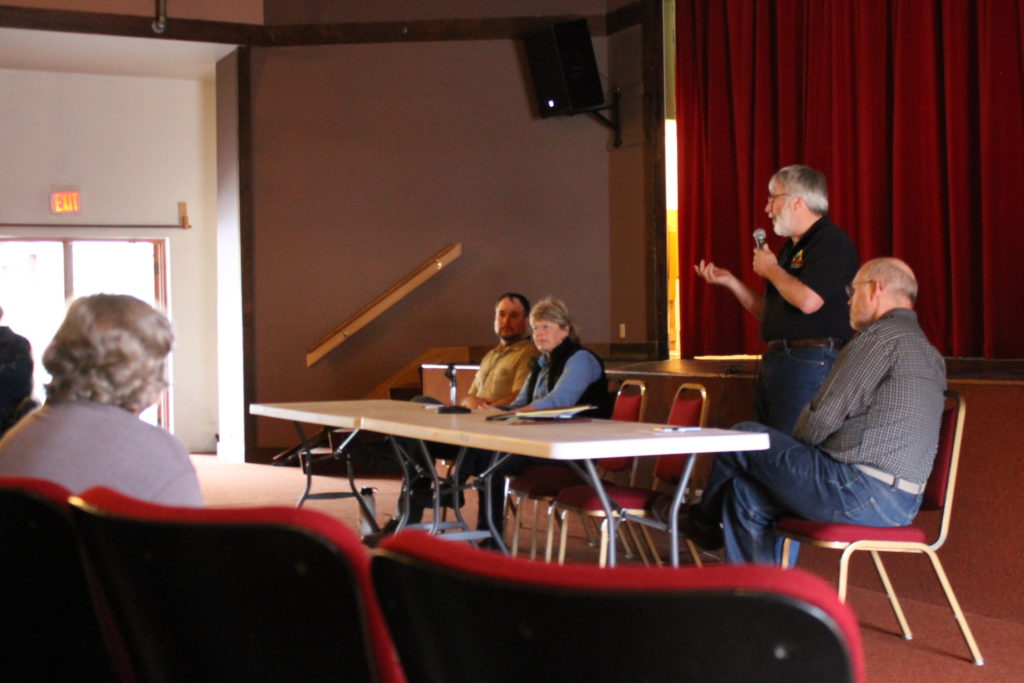 Forest Ranger Jason Anderson, left, University of Alaska Land Management Director Christine Klein, USFS Forester Chris Maisch and Mental Health Land Trust Executive Director Wyn Menefee respond to questions at the timber sale open house. (Photo by Henry Leasia/KHNS)