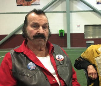 Gust Larson, a retired operating engineer, lives just outside of Wasilla. He came to the Menard Sports Center to celebrate Gov. Mike Dunleavy's inauguration. Dec. 4, 2018. (Photo by Andrew Kitchenman/KTOO and Alaska Public Media)
