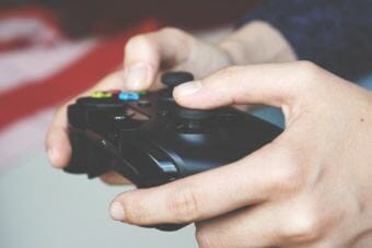 A gamer holds a controller.