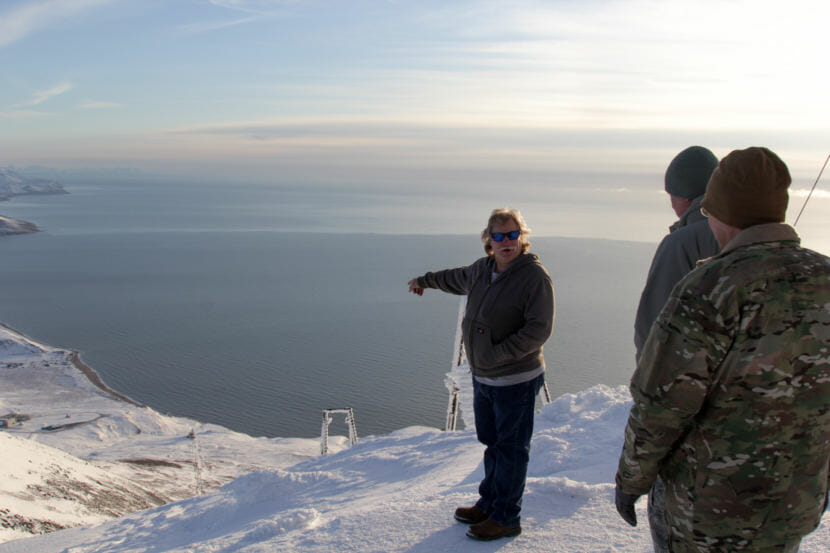 Radar technician Jeff Boulds showing Col Daniel Lemon remnants of the tram that used to carry personnel up to the radar site.