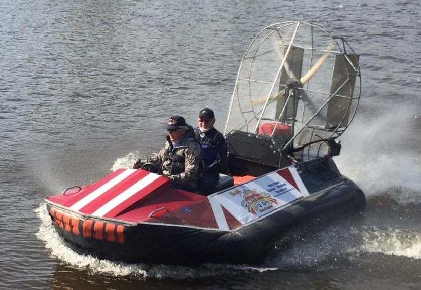 John Sturgeon and U.S. Rep. Don Young, R-Alaska, arrive at a 2018 summer fundraiser in Fairbanks by hovercraft.