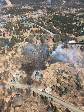 A 2.5-acre brush fire near Ninilchik on the Kenai Peninsula threatened homes Saturday.