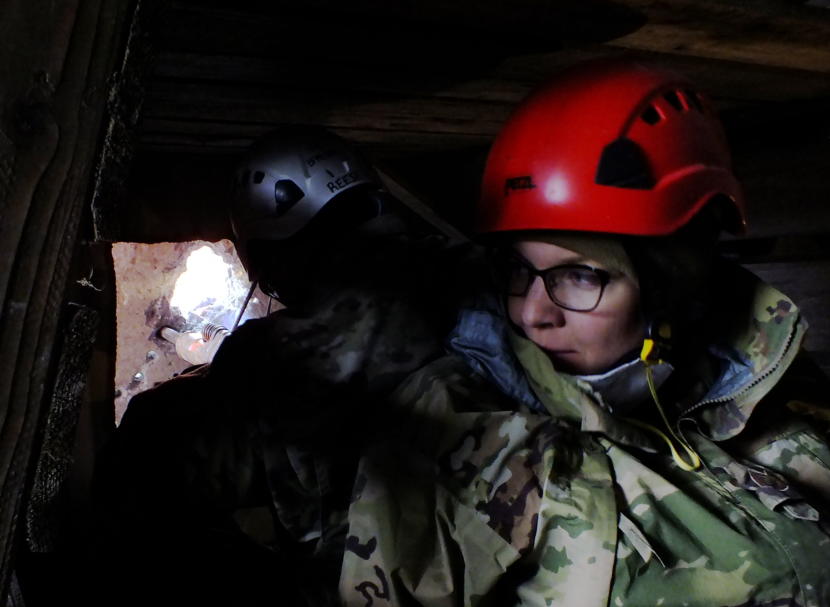 Tech Sgt. Charolette Kane (right) of the Washington National Guard provides support for Tech Sgt. Derek Reese as he jackhammers through reinforced concrete during an urban search and rescue exercise in Juneau on April 12, 2019. Two victims are awaiting rescue on the other side of the slab.