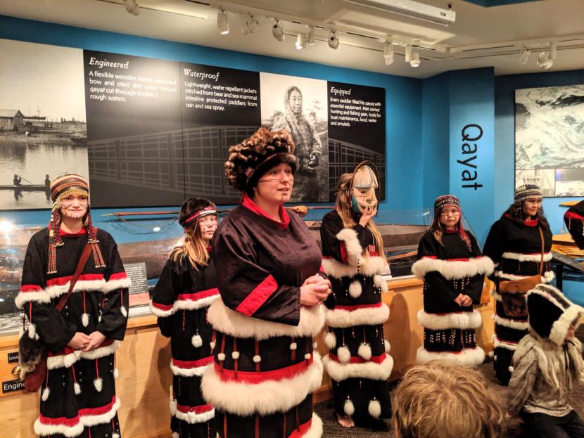 Candace Branson introduces the next song she and and her fellow Alutiiq dancers will perform.