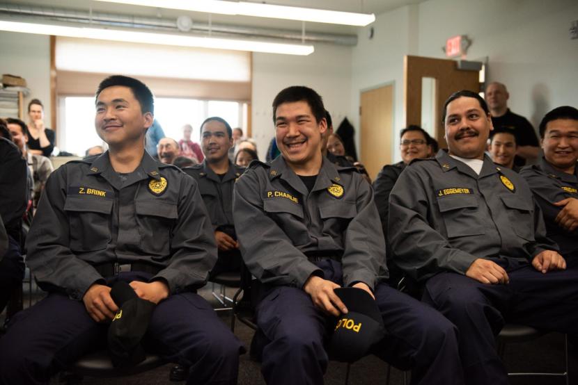 Graduates Nunapitchuk VPO Zachariah Brink, Quinhagak TPO Phillip Charlie, and Afognak Officer Jess Eggemeyer II at the Rural Law Enforcement Training at Yuut Elitnaurviat in Bethel on June 14, 2019.