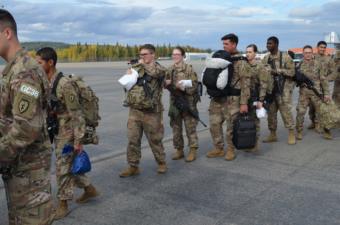 U.S. Army soldiers wait to depart from Fort Wainwright.