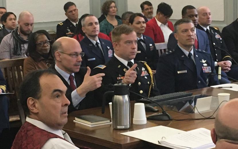 Mike Sfraga, left, wearing glasses, speaks at the Legislature’s annual Joint Armed Services Committee meeting. Sfraga is the director of the Polar Institute at the Woodrow Wilson Center, a Washington, D.C., think tank. He told state lawmakers that Alaska will be at the front line of global competition over Arctic Ocean resources, in the Capitol, Feb. 6, 2020. (Photo by Andrew Kitchenman/KTOO and Alaska Public Media)