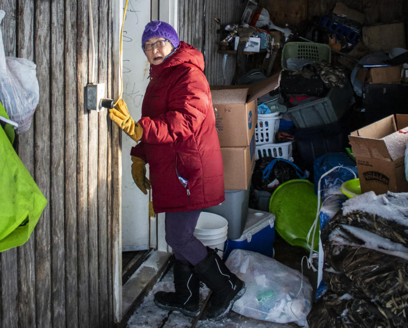 Alice Fitka, tribal president for the Native Village of St. Michael, at the entrance of her home in February 2020. (Photo by JoJo Phillips/KNOM)