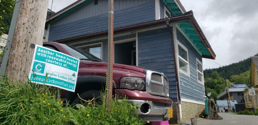 A Juneau Carbon Offset yard sign stands at the corner of Ray Lindoff's home in downtown Juneau on June 5, 2020.