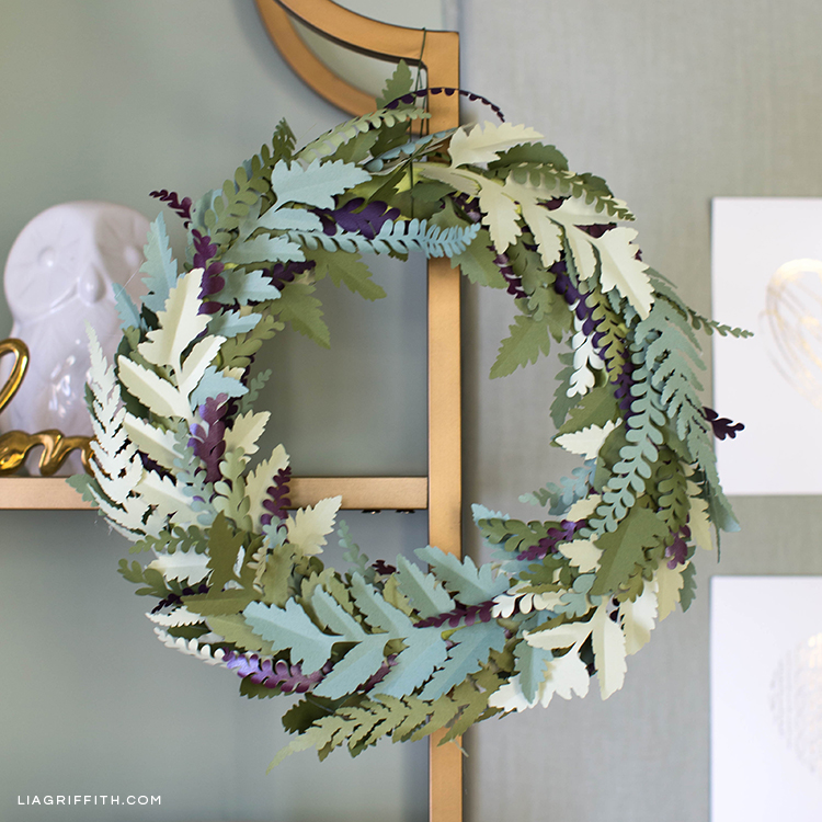 Paper fern wreath on gold shelving unit