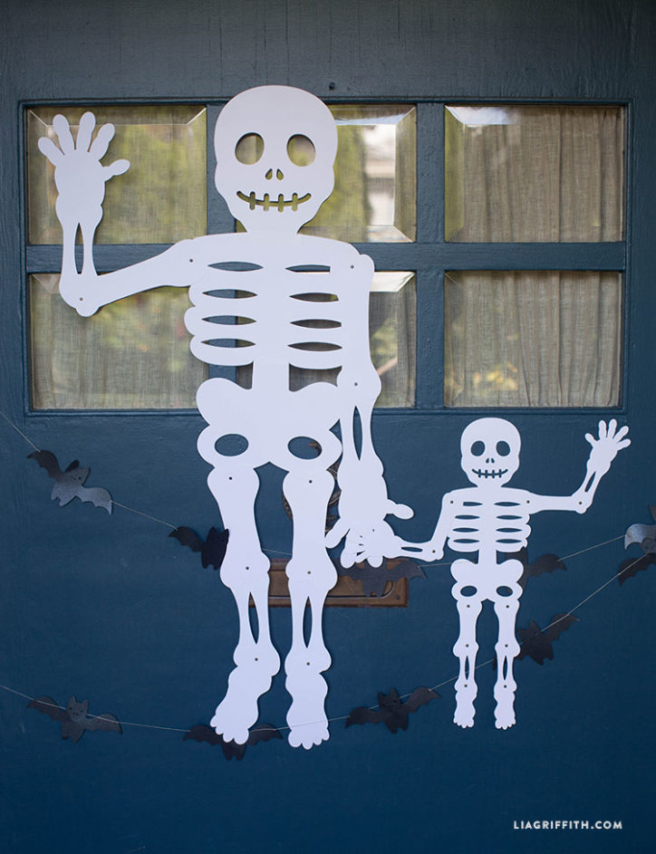 Jumbo Mr. Paper Bones skeleton on front door for Halloween