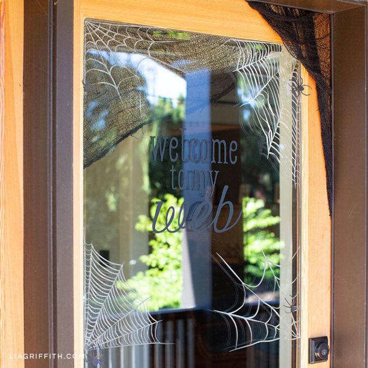 spiderweb window clings on door for Halloween