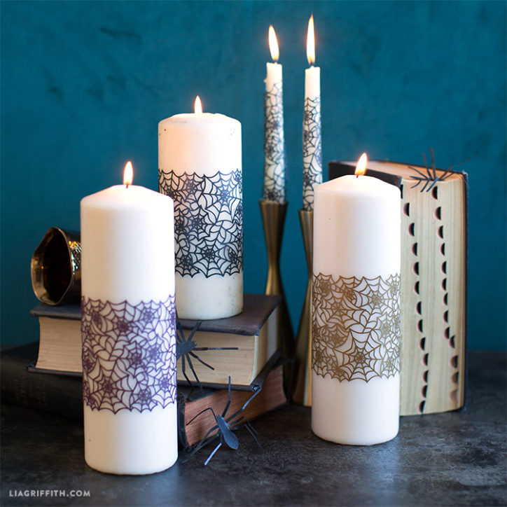 Papercut spiderweb candle wrap on candles