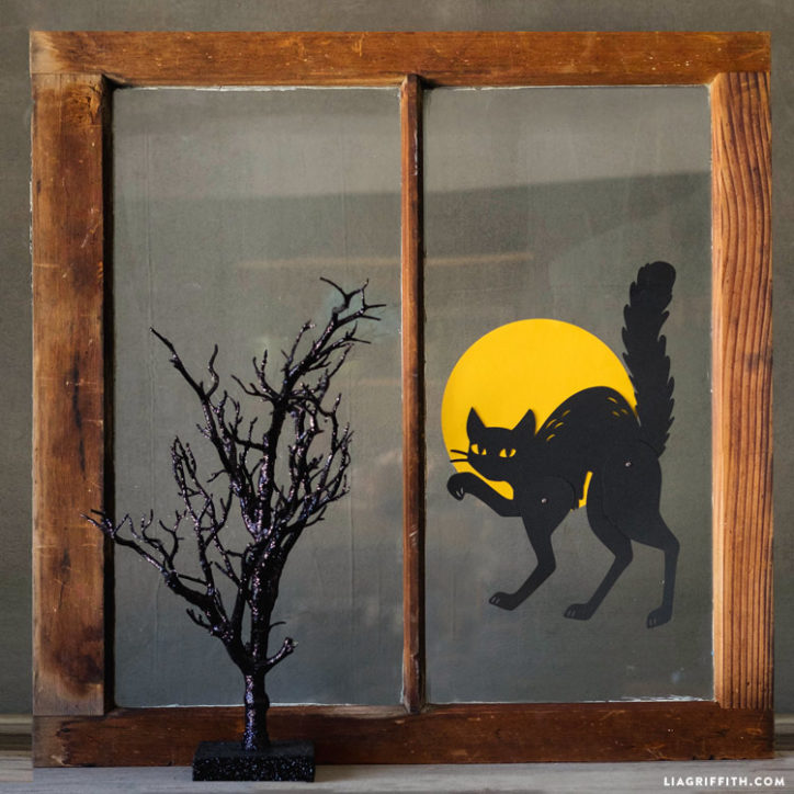 Paper black cat and full moon for window Halloween decorations