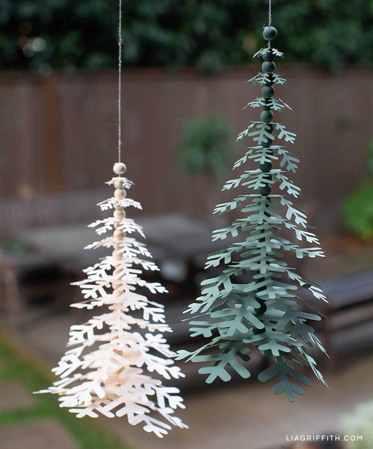 paper snowflake trees hanging on twine