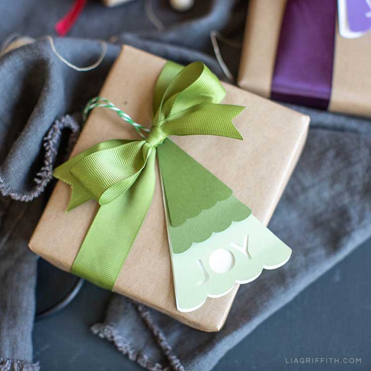 Christmas tree gift tag with the word joy cut out