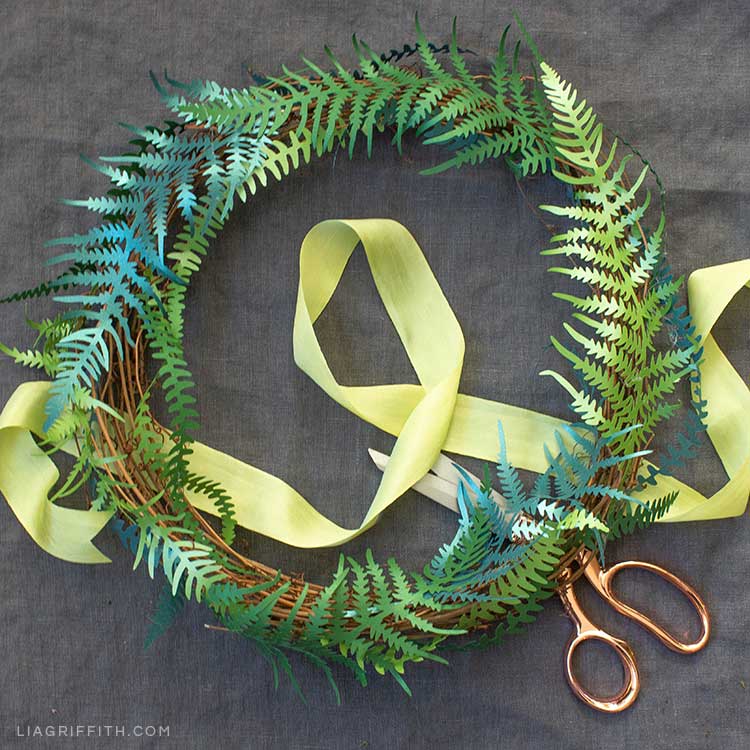 DIY paper fern wreath with ribbon and scissors