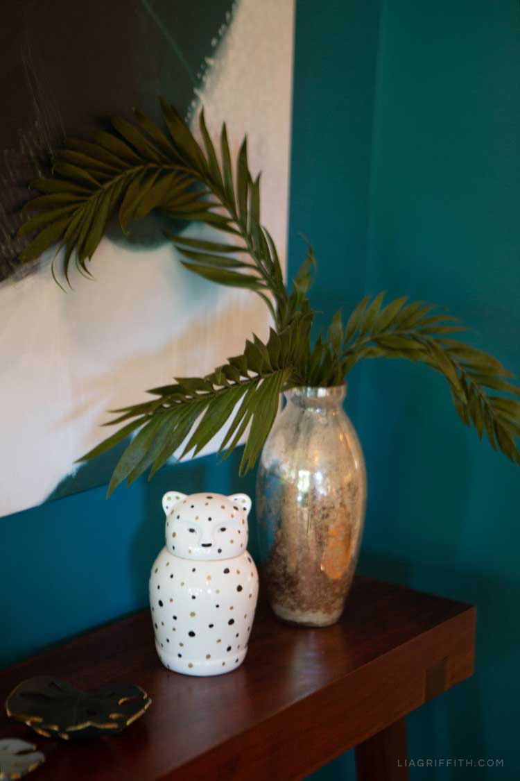 Paper plant in vase on shelf