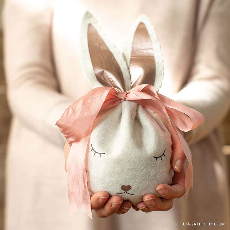 Woman holding felt Easter bunny treat bag