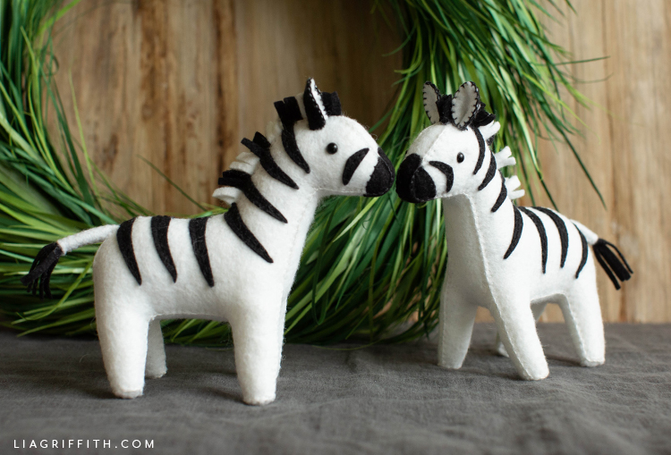 felt zebra stuffies in front of paper wreath