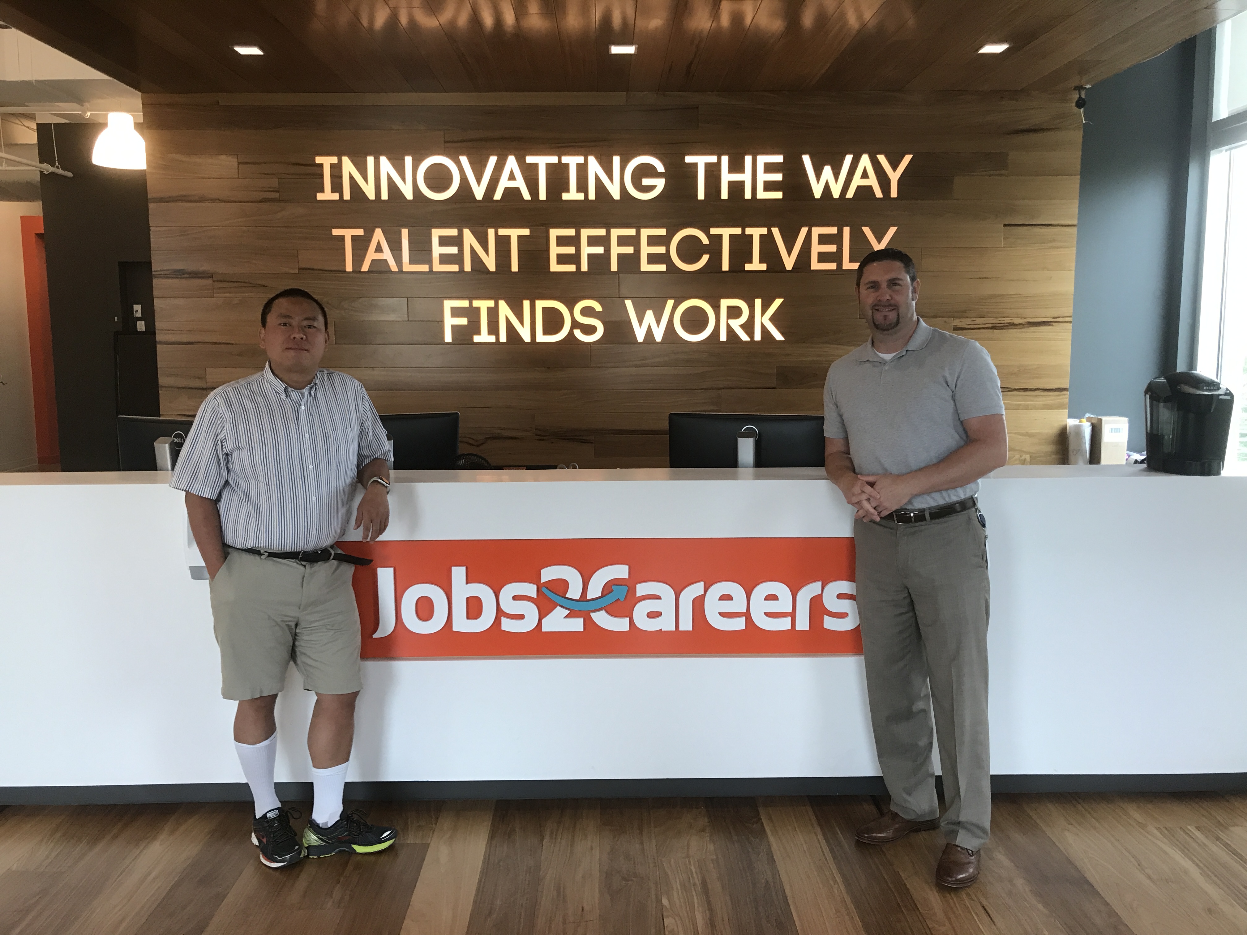 Bruce Ge (Left) and Neil Davis (Right) at Jobs2Careers Headquarters in Austin, TX [image at front desk]