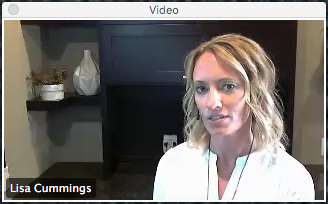 an image showing Lisa in a white shirt doing a virtual training with lighting and focus issues