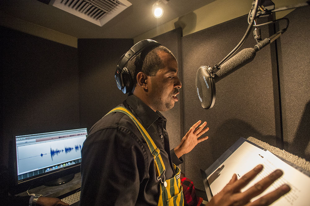 Voice actor records tracks at the Don LaFontaine Voiceover Lab. Photo