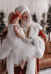 Santa with girl in white