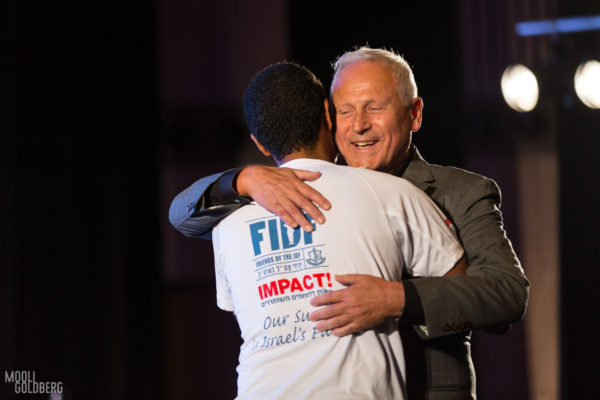 An Israeli veteran meets his FDIF IMPACT! Scholarship Sponsor.