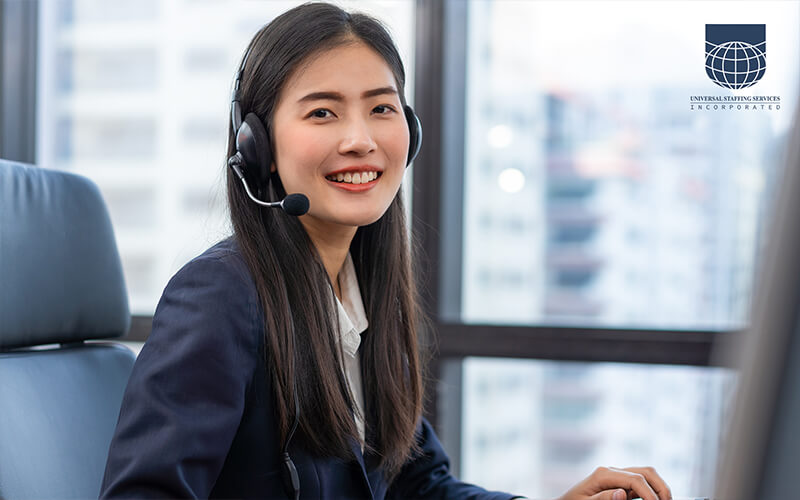 A customer service employee using a headset with a customer on the line