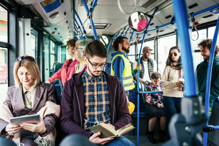 Diverse group of bus riders.