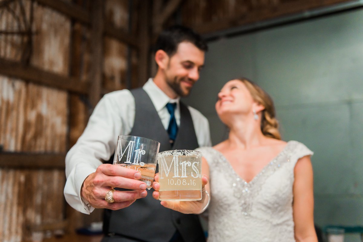 Montesino Ranch Wedding Reception bride and groom with whiskey glasses