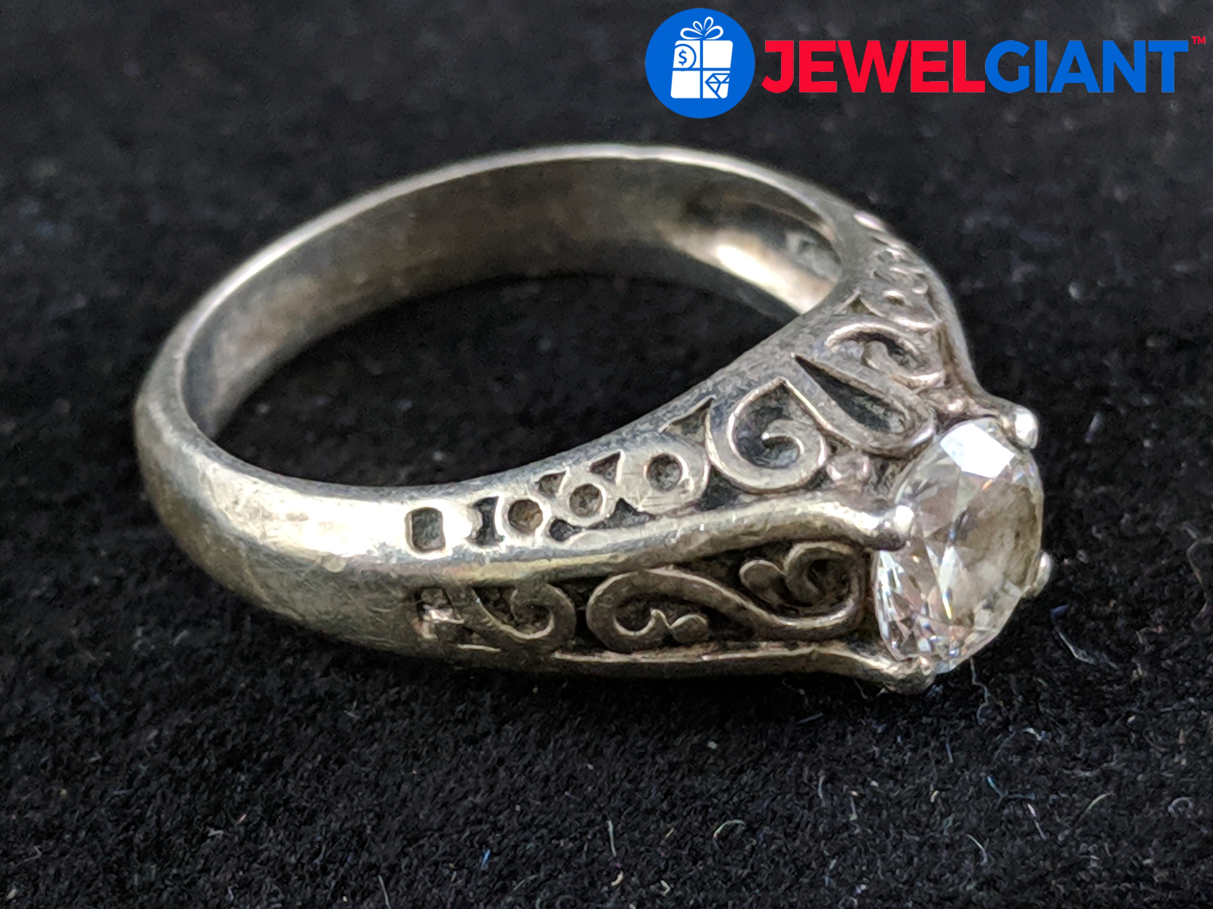 silver ring with white stone