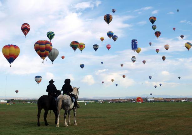 Albuquerque Mounted Police Officers Watch As 500 Rainbow Colored And Designer Shaped Air Albuquerque Mounted Police Officers Watch As 500 Rainbow Colored And Designer Shaped Air